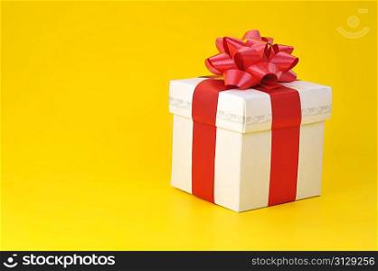 gift box close up isolated on yellow background