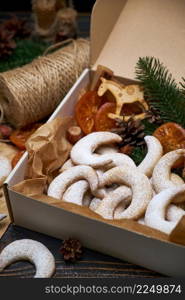 Gift box full of Traditional German or Austrian Vanillekipferl vanilla kipferl cookies. High quality photo. Gift box full of Traditional German or Austrian Vanillekipferl vanilla kipferl cookies