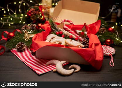 Gift box full of Traditional German or Austrian Vanillekipferl vanilla kipferl cookies. High quality photo. Gift box full of Traditional German or Austrian Vanillekipferl vanilla kipferl cookies