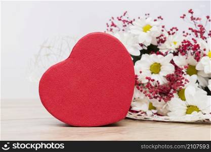 gift box heart shape with flowers bouquet table