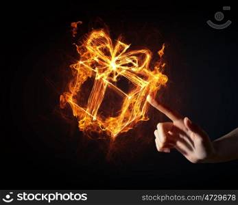 Gift box icon. Glowing fire gift box icon on dark background