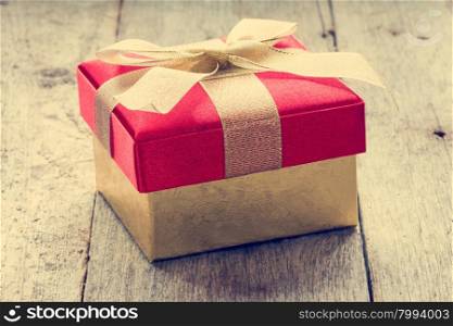 Gift box on old wooden floor, christmas background