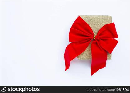 Gift box on white wooden background. Copy space