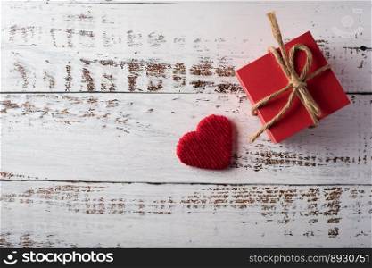Gift box on wood background, valentine’s day concept