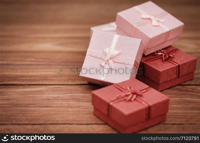 Gift box with as a present for Christmas, new year, valentine day or anniversary on wooden background, Space for write and AF point selection.