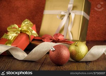 Gift box with christmas elements on wooden background