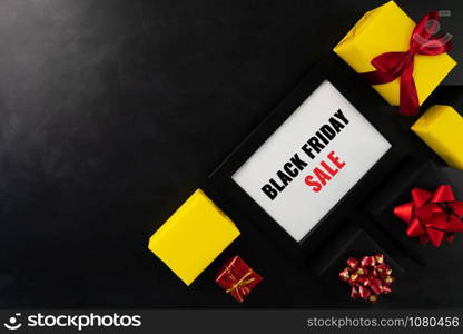 gift box with photo frame for Black Friday Sale concept on black background