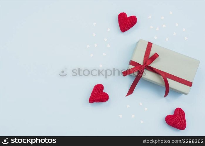 gift box with red toy hearts table