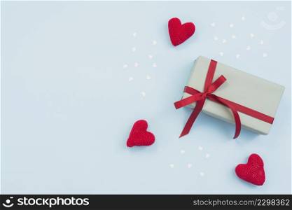 gift box with red toy hearts table