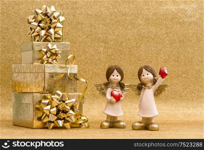 Gift box with ribbon and little angels. Holidays decoration. Valentines Day card concept