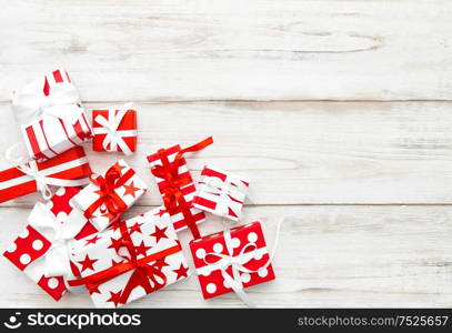 Gift boxes on bright wooden background. Festive arrangement
