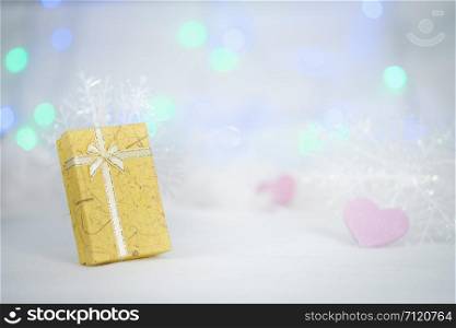 gift boxes on the white fur, bokeh background, with copy space for season greeting, Merry Christmas or Happy New Year.AF point selection,blurred.