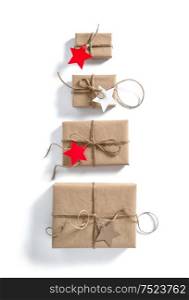 Gift boxes with star shaped paper tag on white background. Holidays concept