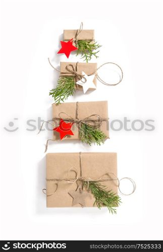Gift boxes with star shaped paper tags on white background. Christmas. Advent