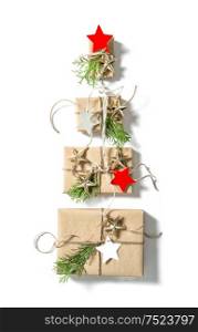 Gift boxes with star shaped paper tags on white background. Christmas holidays concept