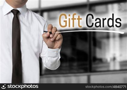 Gift cards is written by businessman background concept. Gift cards is written by businessman background concept.