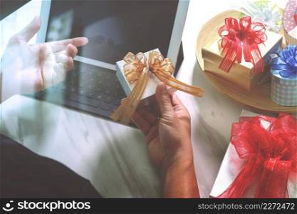 Gift giving Creative Hand choosing and hand with gift. Gift delivery, surprise,tablet computer docking smart keyboard smart phone on mable desk,vintage film effect