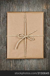 Gift in brown paper tied with string