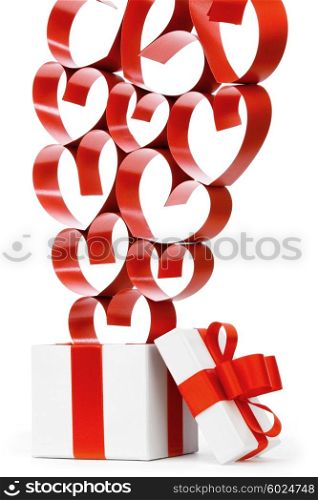 Gift in white box with red ribbons and hearts isolated on white background