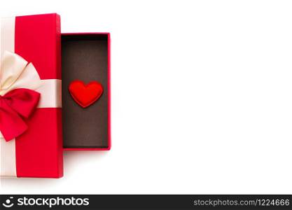 Gift or gift box, red heart inside the box on a white background top view. Greeting card for Valentine&rsquo;s Day.. Gift or gift box, red heart inside the box on a white background top view. Greeting card for Valentine&rsquo;s Day