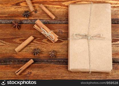 gift Packed in eco-friendly biodegradable cardboard on dark old wooden background with blank space for text. top view. flat lay