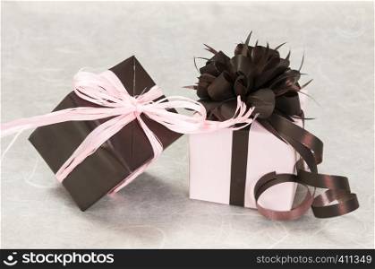 gift pink and brown box with ribbons and bow