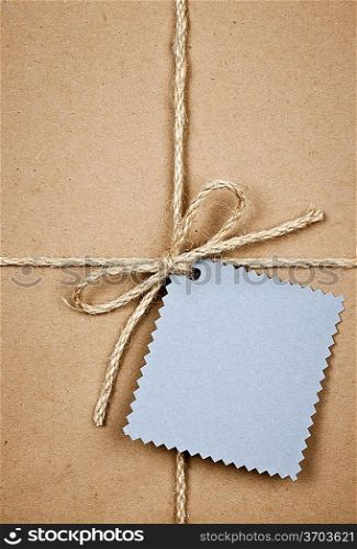 Gift with blue card in brown paper