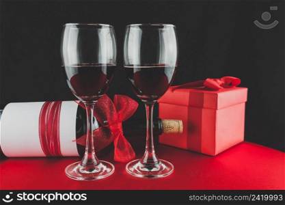 gift with bottle wine two glasses with red wine