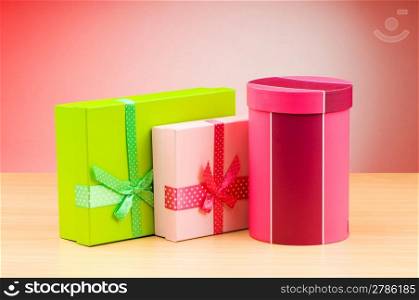 Giftboxes against gradient background