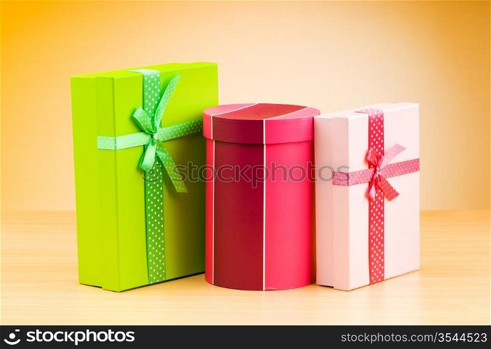 Giftboxes against gradient background