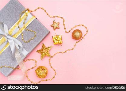 gifts boxes or presents boxes with golden bows, star and ball on pink background for birthday, christmas or wedding ceremony