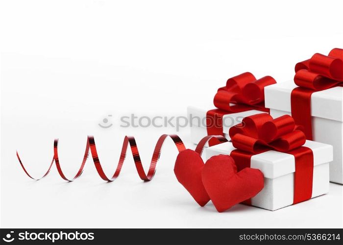 Gifts boxes with red ribbons and textile hearts, valentines day concept