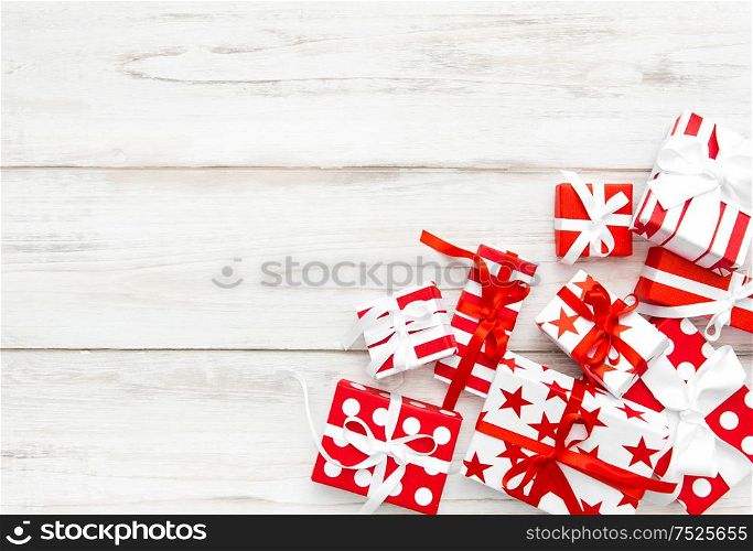 Gifts on wooden background. Holidays decoration