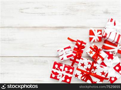 Gifts on wooden background. Holidays decoration