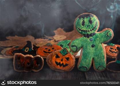 Ginger biscuits for Halloween holiday on wooden table with copy space. Ginger biscuits for Halloween