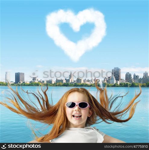 Ginger child with a heartshaped cloud