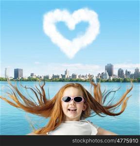 Ginger child with a heartshaped cloud