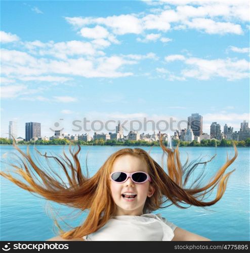 Ginger girl over the town background