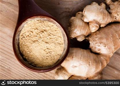 Ginger root and spice closeup on wooden table