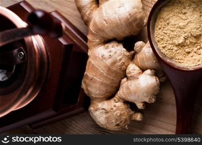 Ginger root and spice closeup on wooden table
