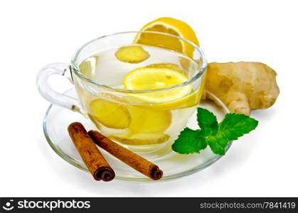 Ginger tea in a glass cup, lemon, cinnamon, ginger, mint isolated on white background