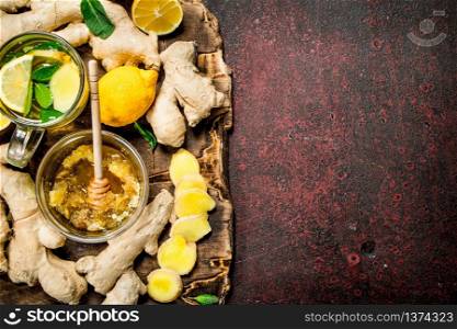Ginger tea with honey. On rustic background.. Ginger tea with honey.