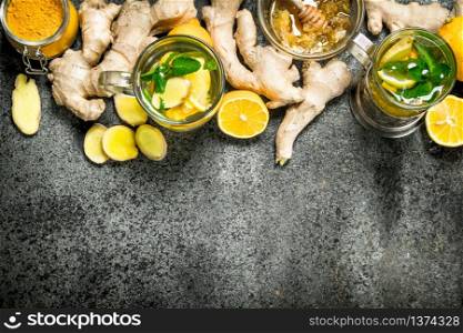Ginger tea with mint and honey. On rustic background.. Ginger tea with mint and honey.