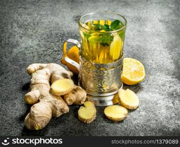 Ginger tea with mint and honey. On rustic background.. Ginger tea with mint and honey.