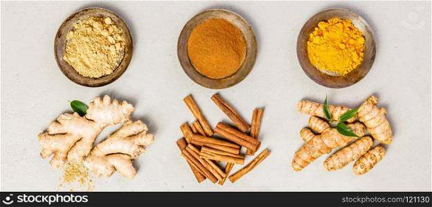 Ginger, turmeric and cinnamon - Spices for healthy drinks - turmeric tea or golden turmeric latte. Top view, copy space