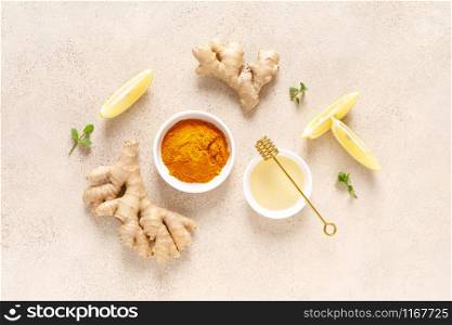 Ginger turmeric tea ingredients, honey, fresh lemon and mint