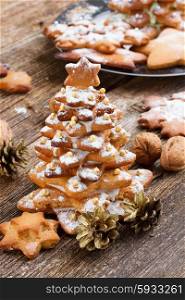 gingerbread christmas tree. Baked gingerbread christmas tree on wooden background