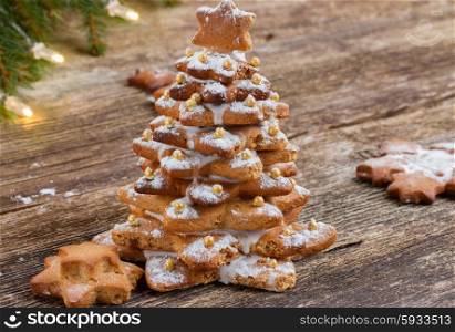 gingerbread christmas tree cookies on wooden background. gingerbread christmas tree