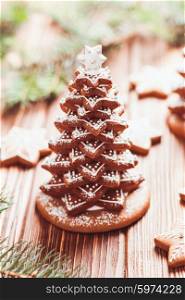 Gingerbread cookies. Christmas tree from cookies with icing on the table. Gingerbread Christmas tree