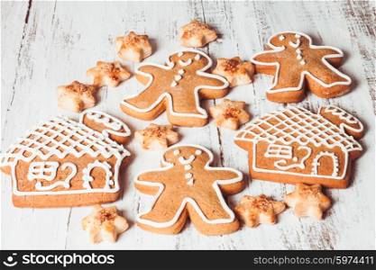 Gingerbread cookies on a white shabby table. Gingerbread cookies